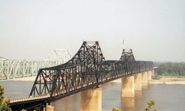 The Yazoo River, the river with the largest drainage area wholly contained in the Mississippi Embayment Study Unit, enters the Mississippi River just north of these bridges at Vicksburg, Mississippi. 