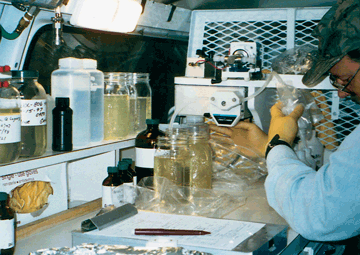 Water samples are filtered and processed in a mobile laboratory immediately after sample collection.