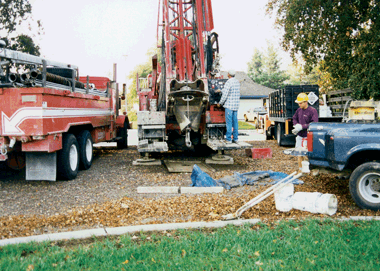 Figure 21. Drilling and installation of a new monitoring well in the Sacramento metropolitan area. This study of shallow ground water was the first of its kind within the Sacramento metropolitan area. 