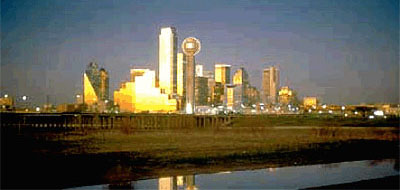 Dallas is reflected in the channelized Trinity River, Texas.  (Photograph courtesy of TEXAS HIGHWAYS Magazine. by Richard Stockton.  Used with permission.)
