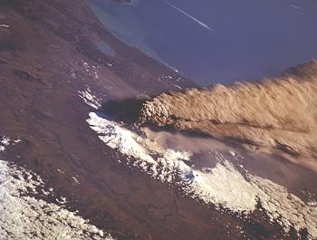 NASA space shuttle photograph of eruption column and cloud from Klyuchevshoy Volcano, Russia
