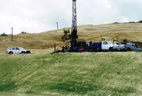 Drill rig installing monitor well