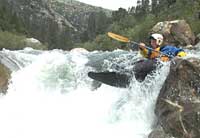 Figure 5 is a photograph showing a kayaker going over a water-fall.