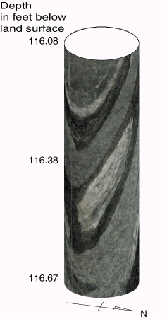 Video image of part of a borehole showing different rock 
      types and fractures.