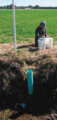 Photo of water sampling from a tile drain