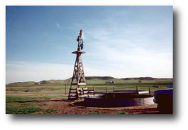 Photo showing Windmill-powered well and livestock-watering tank, Platte County, Wyoming.