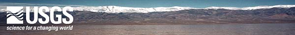 USGS banner that shows extensive flooding in Amargosa River Basin, with snowcapped mountains in background.