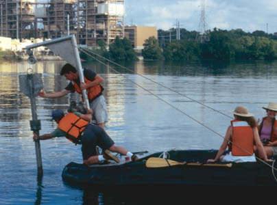 Photograph showing retrieval of gravity core from Town Lake.