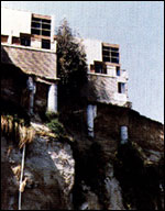 House perched on edge of cliff.