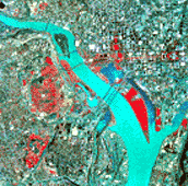 High-altitude color photograph of Washington, D.C., shows more area than figure 8.