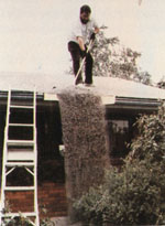 Sweeping ash off roof