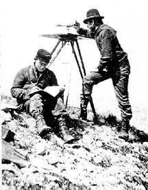  A black and white photograph of two men doing planetable surveying.