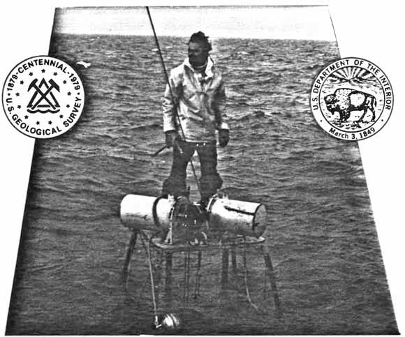 photo of scientist on a small instrument platform in the water