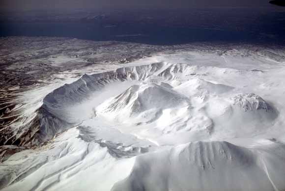 photograph of volcano with snow covering