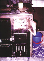 Photograph showing rural use of coal in a stove at a ranch near Rio Turbio