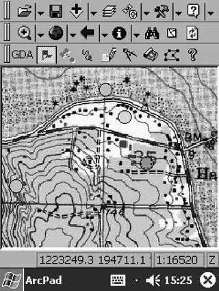 A GDA screen view. The upper two toolbars are standard ArcPad, whereas the lower toolbar is created by GDA. The map shows a digital raster graphic (DRG) of a standard 1:24,000-scale quadrangle map as backdrop, and dots, colored by map unit, at previously established station locations. For a more detailed explanation, contact Ralph Haugerud at rhaurgerud@usgs.gov.
