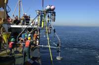 Figure 1.7. Image of the USGS instrumented tripod being deployed in Massachusetts Bay from the U.S. Coast Guard Cutter MARCUS HANNA.