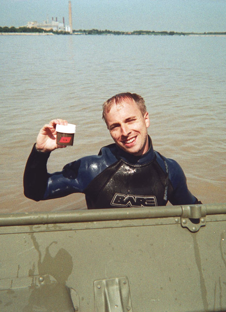 Photograph showing sediment sampling techniques. When feasible, bed sediment was collected into three sterile 125 or 250-mL sampling jars at the site by diving or wading.