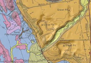 A portion of the surficial geologic map of the Worcester North quadrangle, shown with semitransparent shaded relief on a scanned topographic base map.