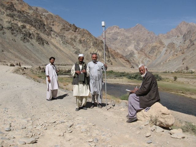 Afghanistan Geological Survey geophysicists operate a proton-precession magnetometer