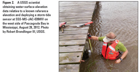 A USGS scientist obtaining water-surface elevation data relative to a known reference elevation and deploying a storm-tide sensor at SSS-MS-JAC-039WV on the west side of Pascagoula Bay in Mississippi, August 28, 2012..