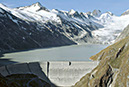 Figure 3-4.–View of dam on Oberaarsee (Lake Oberaar) and Oberaargletscher (Oberaar Glacier) in the background, Bernese Alps, Bern Canton, Switzerland, in September 1978. Photograph by Richard S. Williams, Jr., U.S. Geological Survey. 