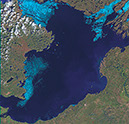 Figure 5-3c –Three Landsat-7 ETM+ images (bands 3, 4, 5) of the breakup of ice on Great Slave Lake, Northwest Territories, Canada (at about latitude 61.5°N., longitude 14.5°W.) on (C) 5 June 2000. Lake ice is shown in light blue, open water in dark blue. Each image covers an area of 185 km by 185 km.