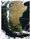 Figure 23.—MODerate-resolution Imaging Spectroradiometer (MODIS) image on 2 October 2005 of the Northern Patagonian Ice Field, the Southern Patagonian Ice Field, the ice field of the Cordillera Darwin, outlet glaciers from each ice field, and other glaciers. Some of the glacially scoured “Finger Lakes” (south to north, Lago Argentino, Lago Viedma, and Lago San Martín) in the center of the image are “robin’s-egg-blue color”, the result of glacial rock-flour sediment entering the lakes. MODIS image from the Aqua satellite; Goddard Space Flight Center, National Aeronautics and Space Administration. 