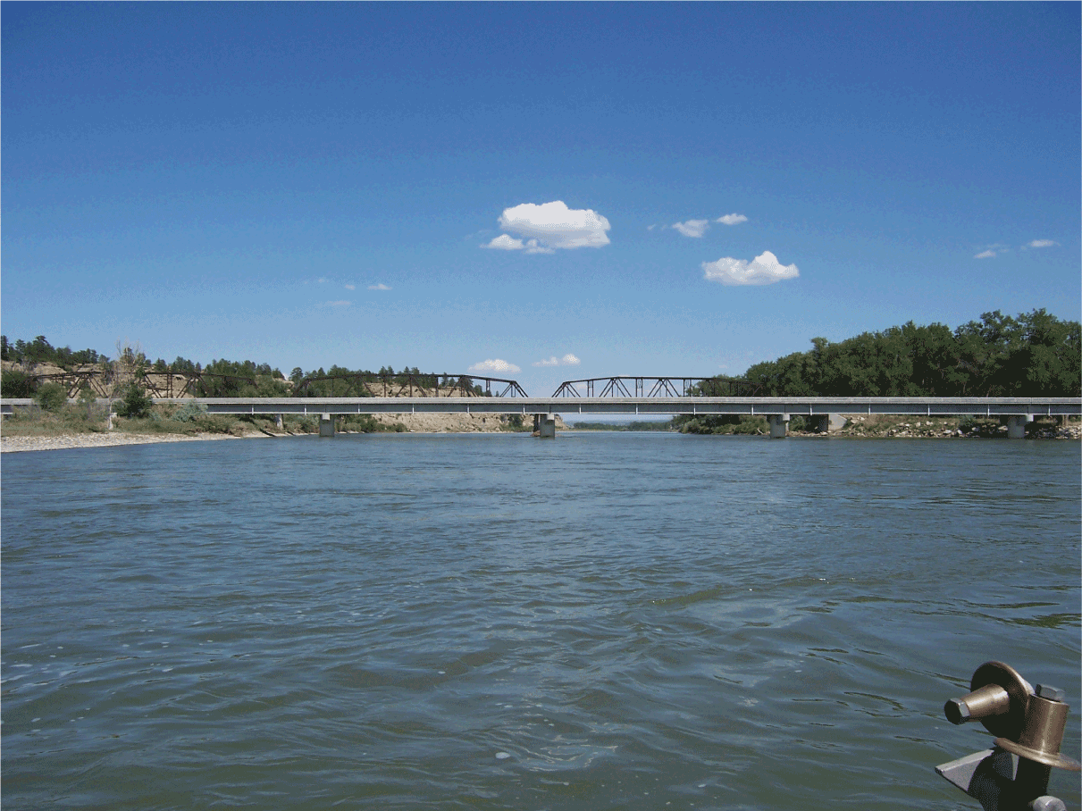 Old (background) and new (foreground) Bundy Road bridges crossing the Yellowstone
                        River near Pompeys Pillar, Montana. Peak streamflow statistics obtained from U.S.
                        Geological Survey statistical models were used to design the new bridge. Photograph
                        by Peter McCarthy, U.S. Geological Survey.