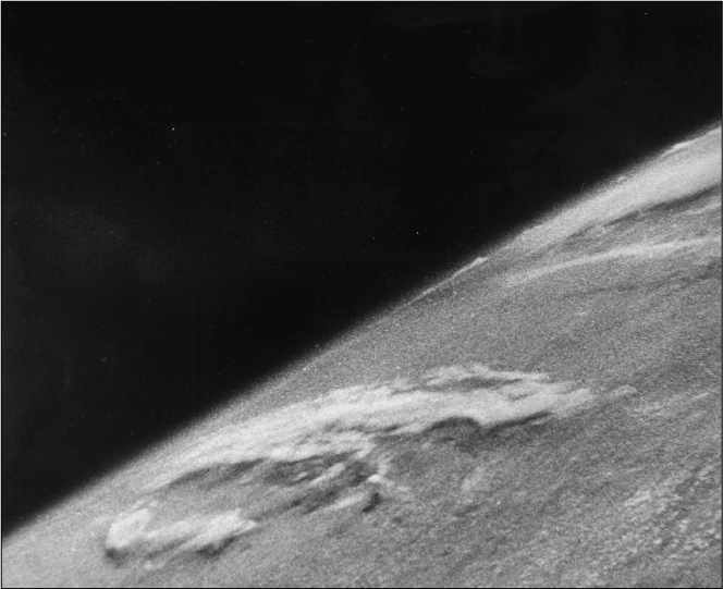 Angle view of the Earth and space that shows clouds in the atmosphere and distant
celestial bodies are barely visible.