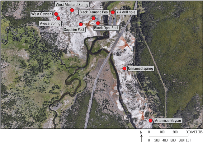 27. A sparsely vegetated landscape with a road, trails, and a river running through
it.