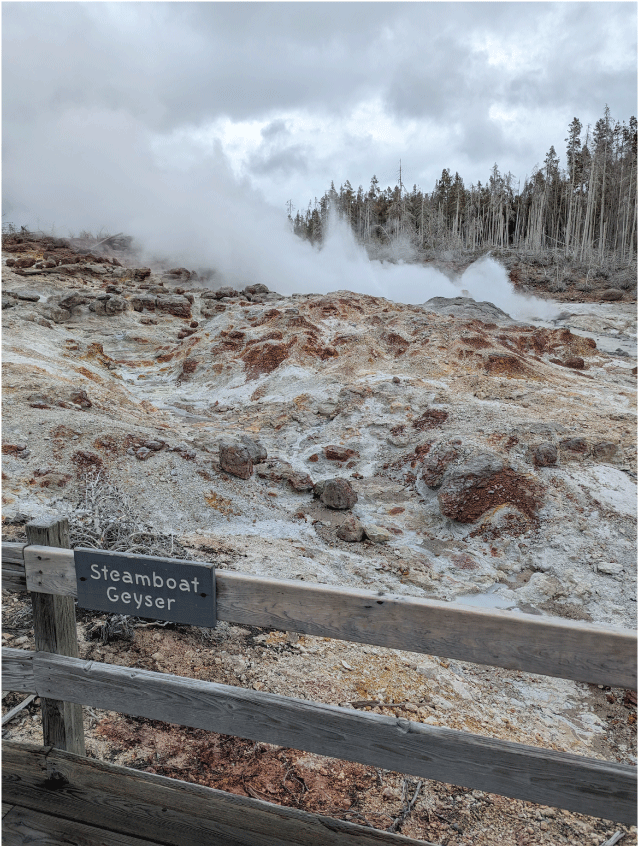 28. Barren area of tan-orange ground that slopes up away from the viewer. Two steaming
features are present in a recessed alcove within the sloping ground.