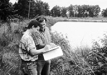 Photo of 2 people discussing water issues.