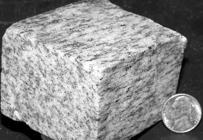 Photograph of polished block of L-tectonite from the Columbia pluton, Cowherd quarry, Fluvanna County, Va. (Stop 9). For a more detailed explanation, contact David Spears at david.spears@dmme.virginia.gov.