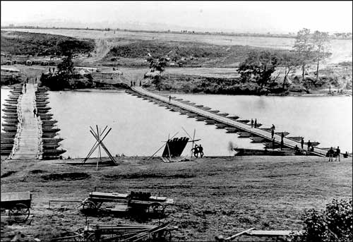  Historical photograph of the upper pontoon bridges at the north end of Fredericksburg,
	   looking east toward Stafford Heights. For a more detailed explanation, contact Judy Ehlen at 1408 William Street, Fredericksburg, VA 22401.