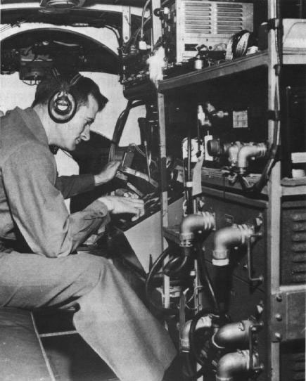 Figure 36. Photo of geologist operating airborne magnetic equipment, 1945.