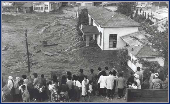 photo of people watching flooding