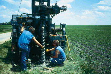 Figure 11. Study-Unit staff installed 57 wells to sample recently recharged ground water. Assistance and geological expertise was provided by the Illinois State Geological Survey. (Photograph by William S. Morrow, Jr., USGS.)