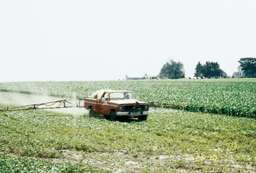 Figure 17. Pesticides are used to protect crops and increase production. Pesticides are often sprayed directly on the plants in the field. Other pesticides are incorporated into the soil, partly to limit the amount of chemical that leaves the field. (Photograph by Kelly L. Warner, USGS.)