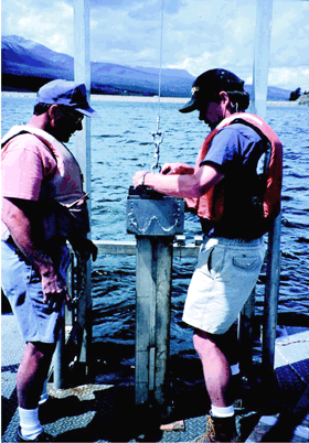 Collecting sediment core samples on Dillon Reservoir. (Photograph by Norman Spahr, U.S. Geological Survey.)