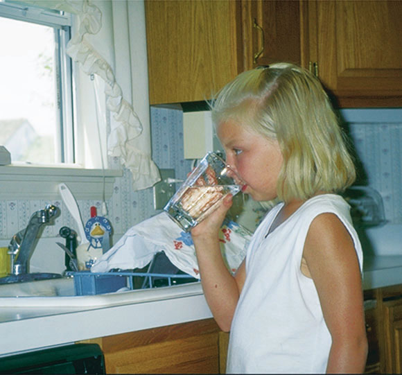Photo of little 
girl drinking water