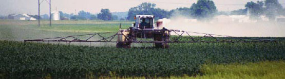 Photo to farmer spraying his field