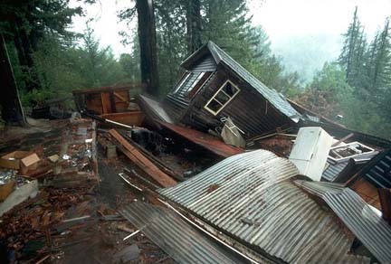 image of house fallen down a hill