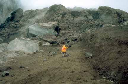 Photograph of geologist among blocks
