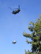 [Photo of helicopter and boat flying overhead] 