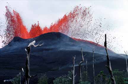 photo 017.  Photo of summit area of volcano with red-hot lava spattering onto accumulation of now-cooled black lava