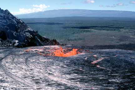photo 025.  Photo taken from crater looking out and down to forest below.  Pool of red-hot lava in foreground