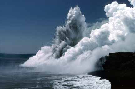 photo 043.  Photo of vast steam clouds forming as the sea boils due to molten lave flowing into it