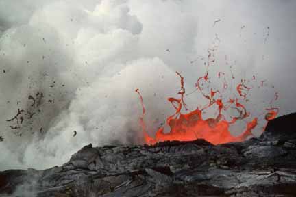 photo 049.  Close-up photo of spatter and small fragments of lava in the air above steaming ocean