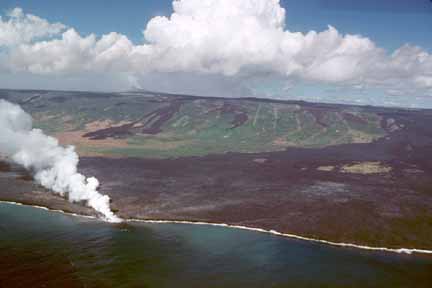 photo 057.  Photo of lava flowing on shore with ocean in foreground